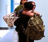 Capt. Nicholas Limentato is hugged by his girlfriend, Audrey Newlin after his April 14 arrival at the University of Illinois Willard Airport