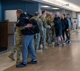 About a half dozen Soldiers from the Illinois Army National Guard's 232nd Combat Sustainment Support Battalion were greeted by senior leaders after flying into the Abraham Lincoln Capital Airport in Springfield, April 14.