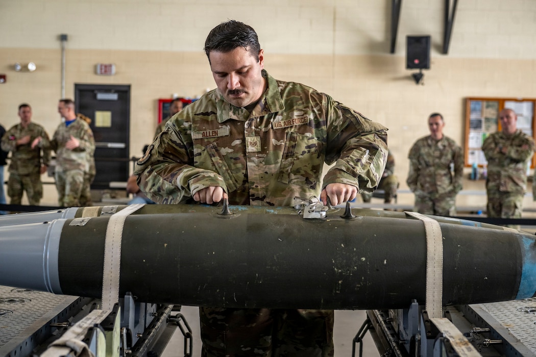 Airman inspecting a munitions device.