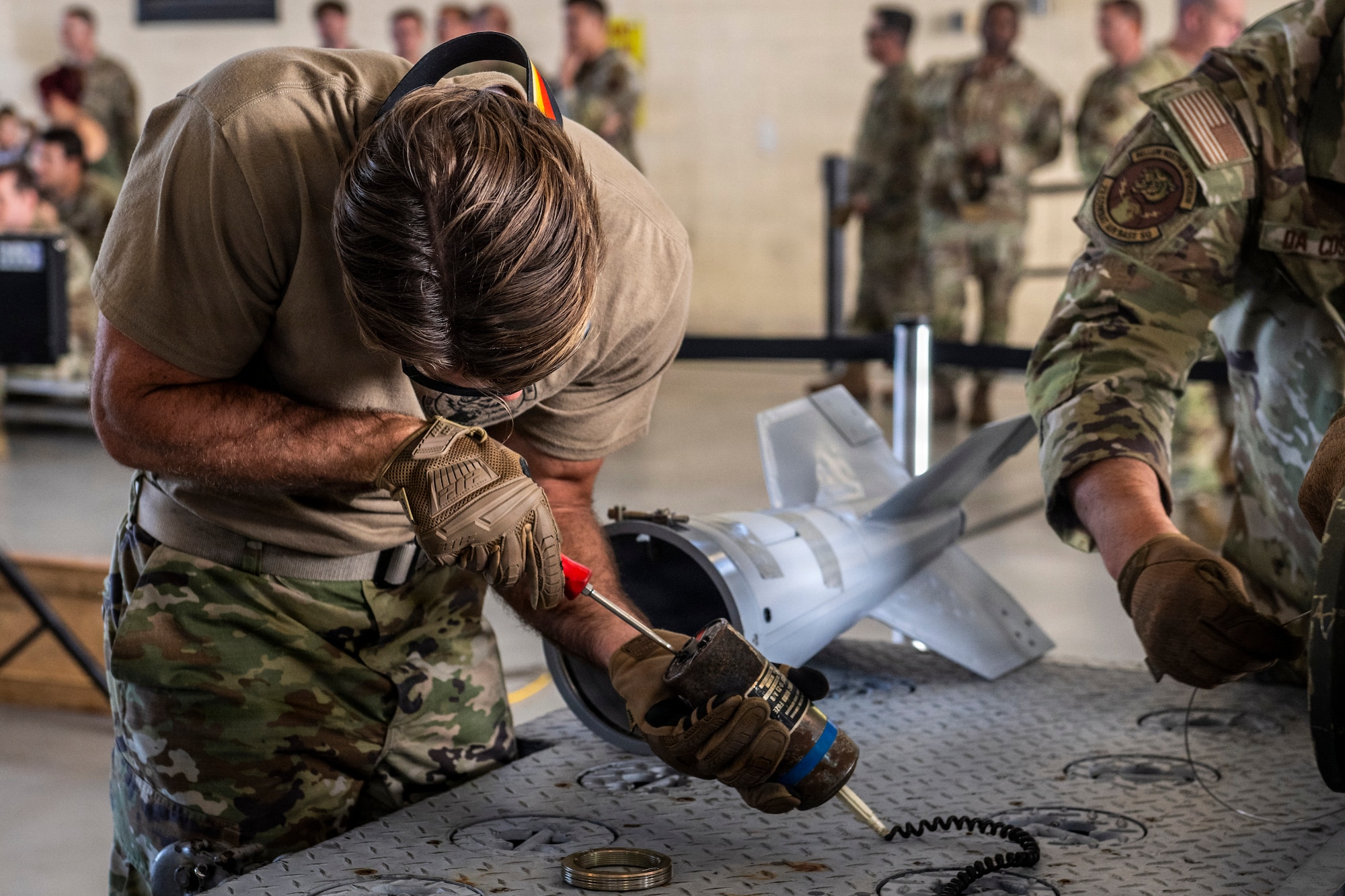 Airman building a munition device.