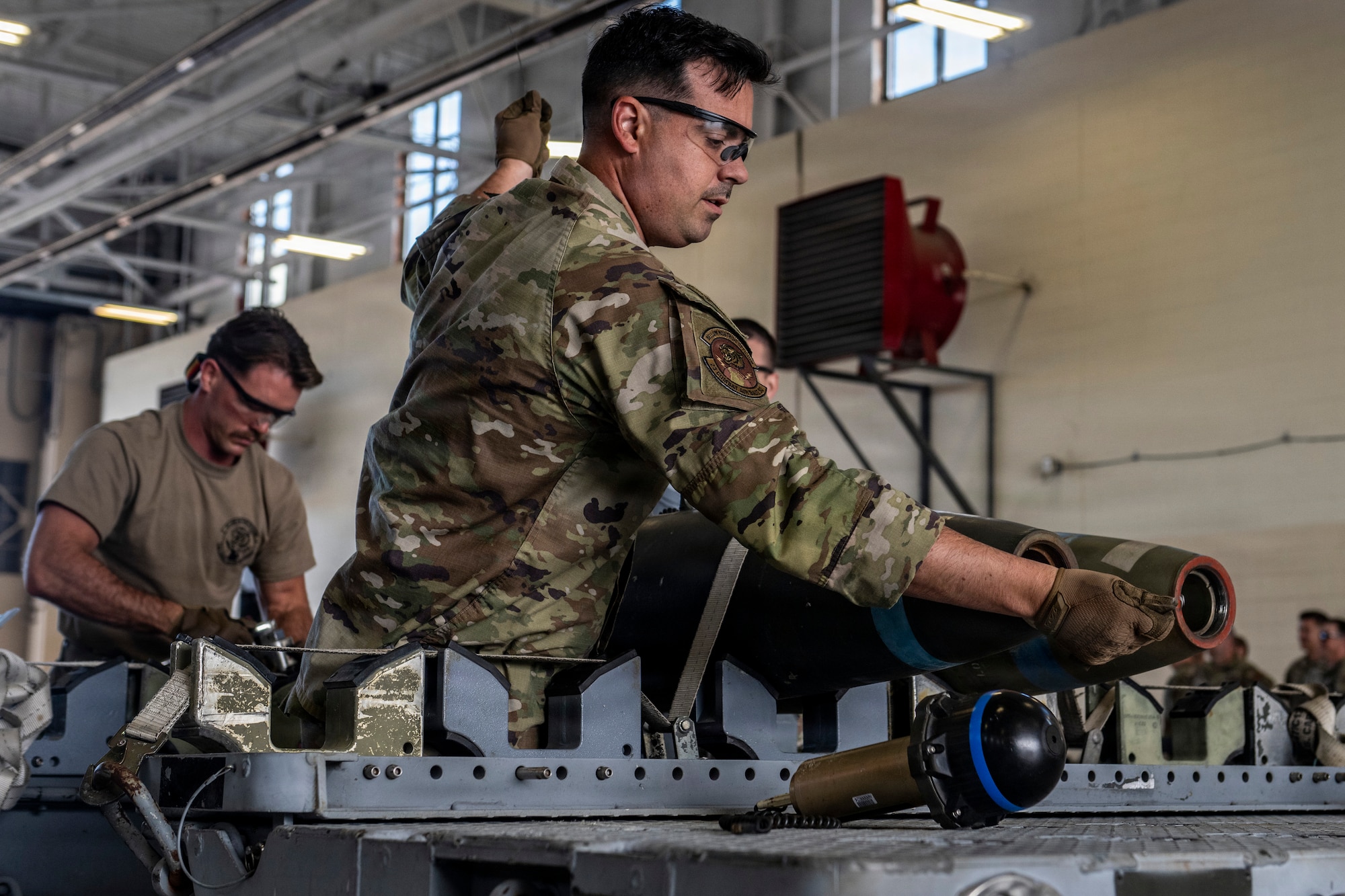 Airman building a munitions device.