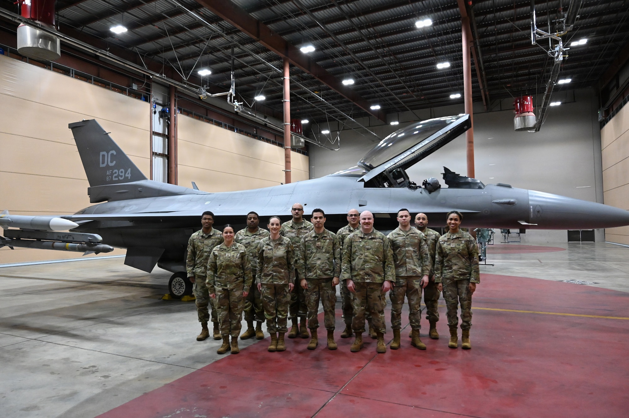 The 113th Command Post poses for a group photo in their alert control facility at Joint Base Andrews, Maryland, Mar. 23, 2026. The team was recognized as the 2025 Continental Northern American Aerospace Defense Command Region (CONR NORAD) Aerospace Control Alert (ACA) unit of the year. (U.S. Air National Guard photo by Senior Master Sgt. Craig Clapper)