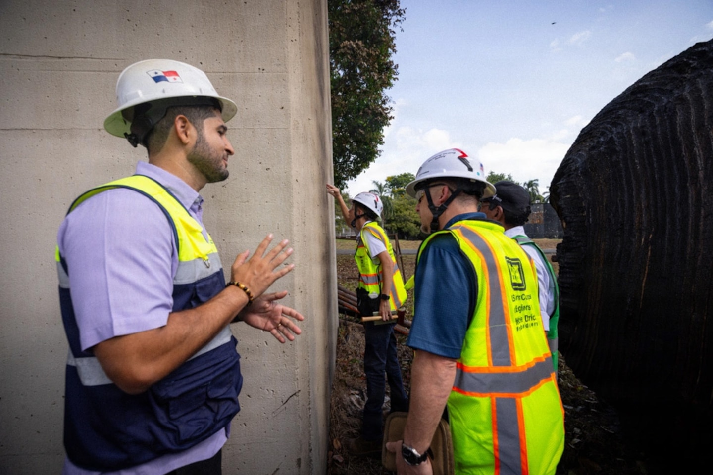 Several men working on a bridge.