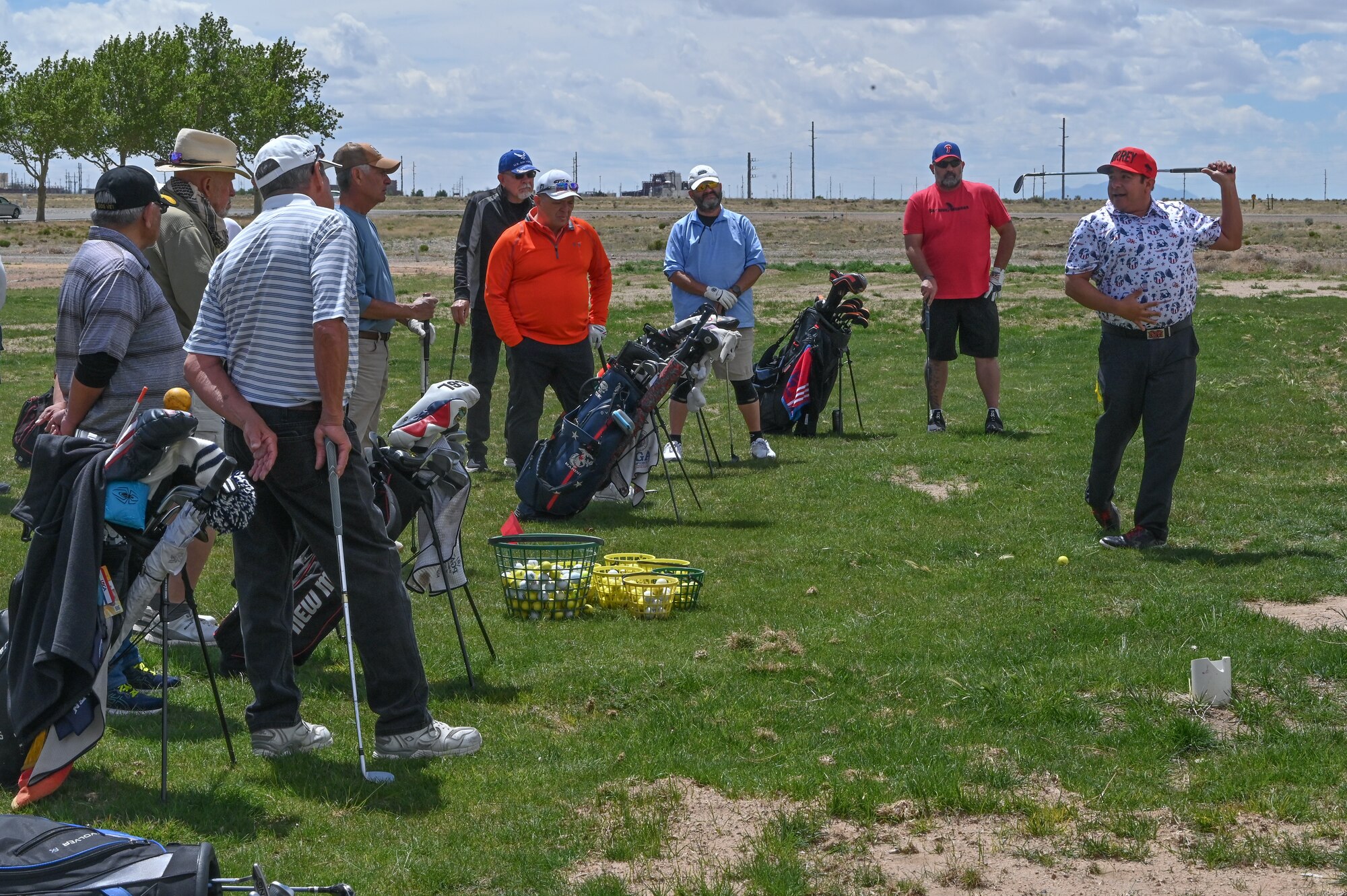 Veterans and active-duty military observe the fundamentals of a swing at the Professional Golf Association’s (PGA) Helping Our Patriots Everywhere (HOPE) event at Kirtland Air Force Base, N.M., Apr. 14. PGA’s HOPE program has 624 locations with notable military installations including, Fort Bliss, Scott Air Force Base, Joint Base Langley-Eustis, and MacDill Air Force Base. (U.S. Air Force photo by Airman 1st Class Angel Diaz)
