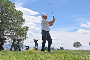 Steve Montoyo, a U.S. Army veteran, practices his golf swing at the Professional Golf Association’s (PGA) Helping Our Patriots Everywhere (HOPE) event at Kirtland Air Force Base, N.M., Apr. 14. Montoyo spent 24 years in the U.S. Army as part of a Critical Air Transport Team (CCATT) with deployments to Iraq and Afghanistan. (U.S. Air Force photo by Airman 1st Class Angel Diaz)