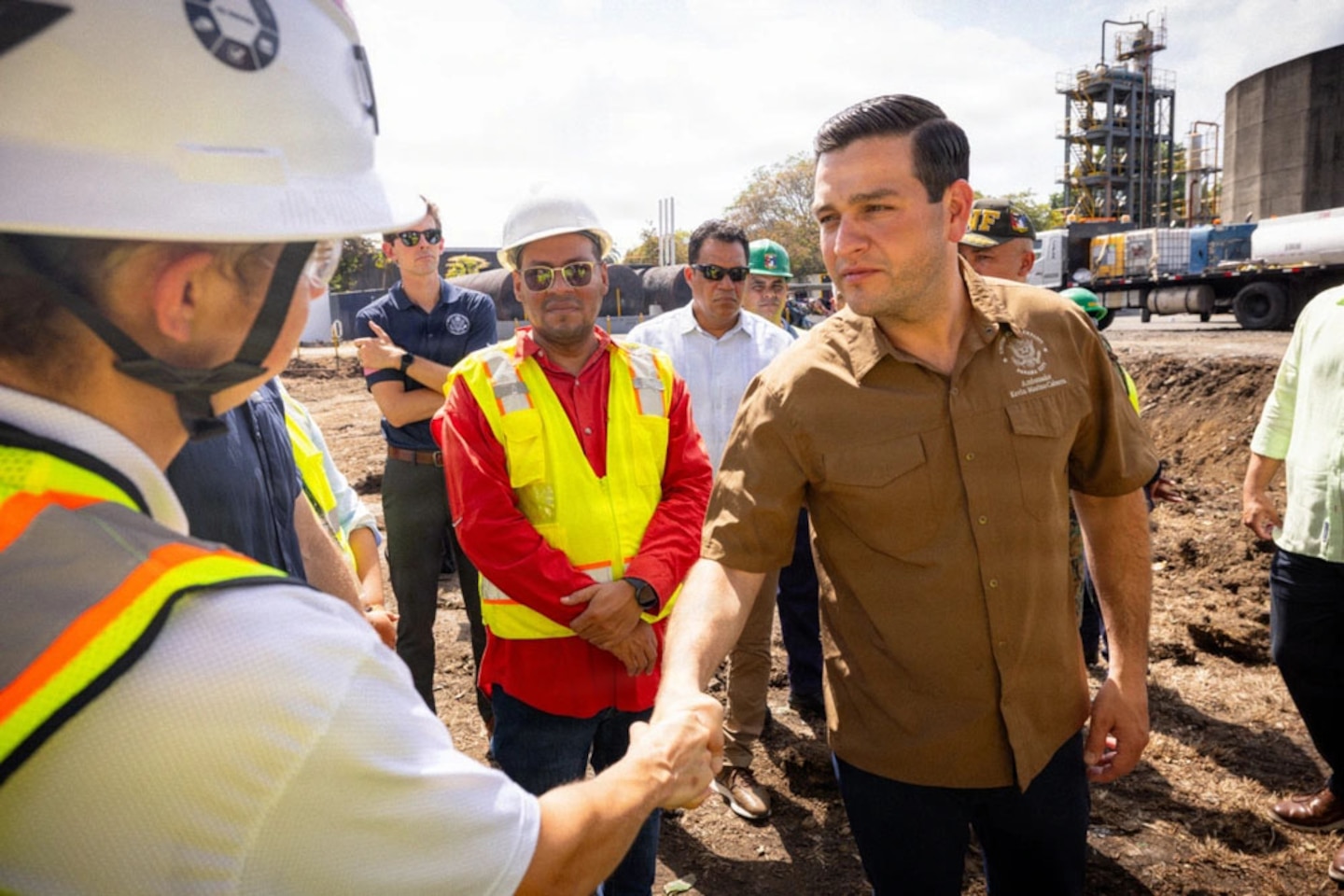 Men shaking hand at a bridge