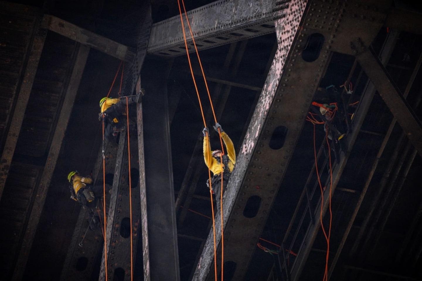 People working on a bridge.