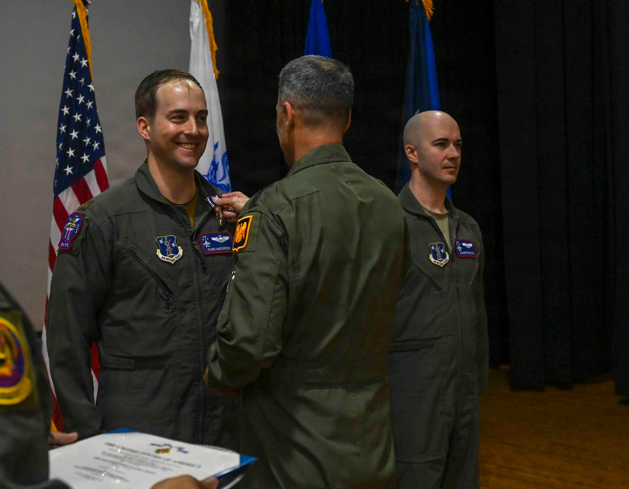 U.S. Air Force Gen. Steven Nordhaus, chief of the National Guard Bureau, awards three F-16 pilots from the 121st Fighter Squadron, District of Columbia Air National Guard, the prestigious Distinguished Flying Cross with “C” device for combat in a ceremony on Joint Base Andrews, Maryland, Feb, 1, 2026. The awards recognize actions by Majs. Benjamin “Boom” Saunders, Eric “Fume” Anderson and Capt. Ryan “Hammer” Boodee on April 13, 2024 while deployed to Prince Sultan Air Base, Saudi Arabia.