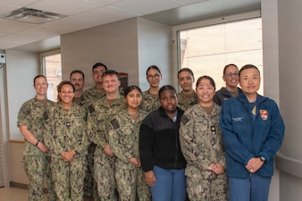 PORTSMOUTH, Va. (April 13, 2026) Corpsmen and Corpsman Residency Program (HMRP) facilitators take a group photo at Naval Medical Center Portsmouth (NMCP), April 13, 2026. HMRP is a 10-week cohort program that aims to provide standardized training and integration into the medical field for new corpsman, blending administrative, on-boarding processes, hands-on clinical skills training and simulation, military readiness, and rotations across in-patient units. It is an exciting opportunity for corpsmen to branch out of their assigned roles and learn about a variety of different functions in the medical center. (U.S. Navy photo by Mass Communication Specialist 2nd Class Thomas Boatright)