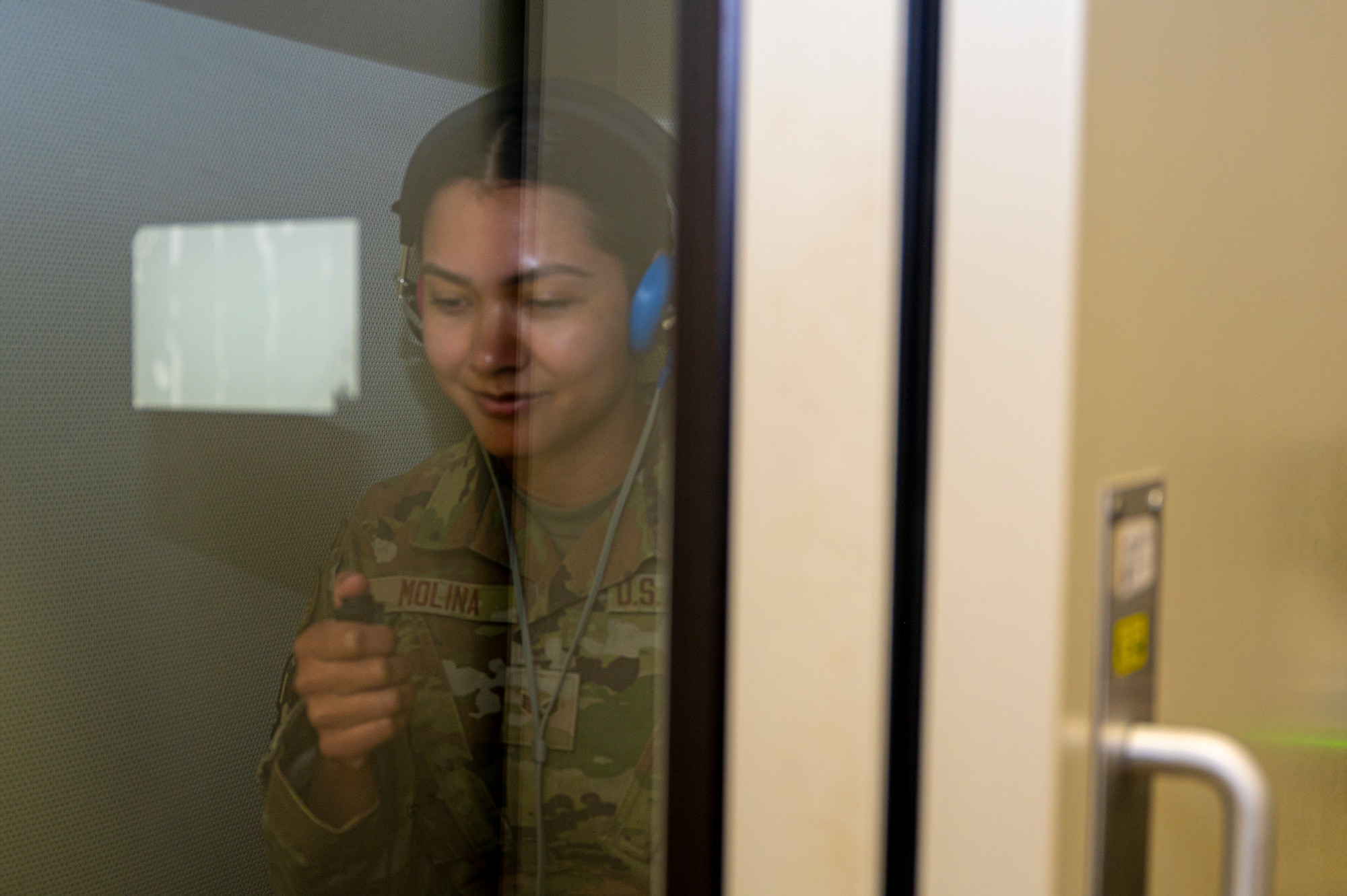 U.S. Air Force Senior Airman Enmy Molina Martinez, occupational health technician with Bolling Medical Squadron Public Health, undergoes a hearing test at Joint Base Anacostia-Bolling, Washington, D.C., April 8, 2026. The hearing test was just one of multiple, medical diagnostic procedures given to Airmen prior to deployment for measuring physical and mental readiness. (U.S. Air Force photo by Senior Airman Shanel Toussaint)