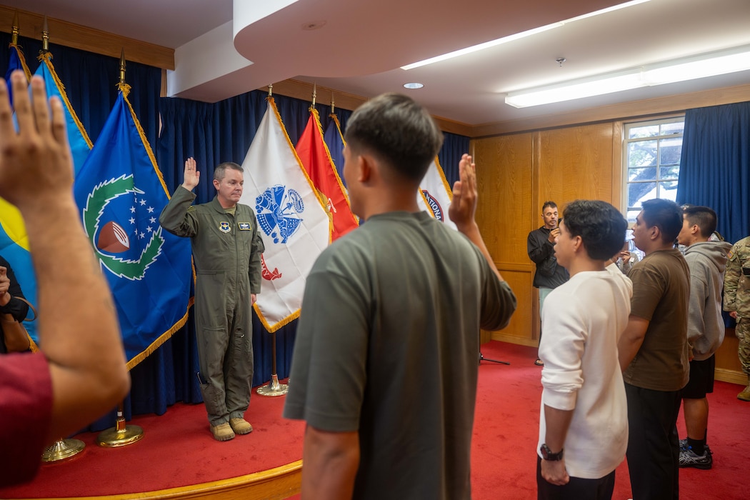 U.S. Air Force Brig. Gen. Jeffrey W. Nelson, commander of the Air Force Accessions Center and Air Force Recruiting Service, administered the Oath of Enlistment to 11 Delayed Entry Program members at the Joint Base Pearl Harbor-Hickam Military Entrance Processing Station in Honolulu, Hawaii, April 13, 2026. Nelson visited Hawaii to meet with recruiters, new recruits, ROTC instructors and cadets during the Pacific Air Forces tour. (U.S. Air Force photo by Senior Airman Aden Brown)