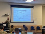 Sgt. 1st Class Austin Haitt, 205th Regional Training Institute, speaks at the Executive Officers Course, April 11, 2026, Camp Murray, Washington. Courtesy photo.