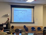 Sgt. 1st Class Austin Haitt, 205th Regional Training Institute, speaks at the Executive Officers Course, April 11, 2026, Camp Murray, Washingto