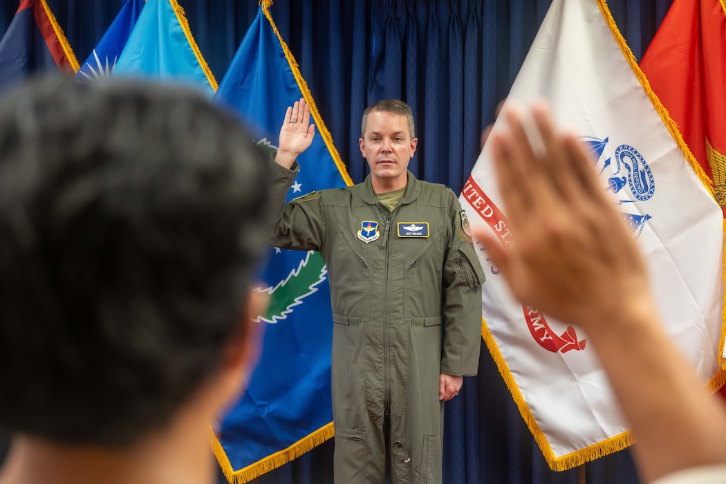 U.S. Air Force Brig. Gen. Jeffrey W. Nelson, commander of Air Force Recruiting Service, administers the Oath of Enlistment to 11 Delayed Entry Program members at the Joint Base Pearl Harbor-Hickam Military Entrance Processing Station in Honolulu, Hawaii, April 13, 2026. Nelson oversees all U.S. Air Force and U.S. Space Force recruiting operations, as well as the Air Force Reserve Officer Training Corps and other recruiting programs. (U.S. Air Force photo by Senior Airman Aden Brown)