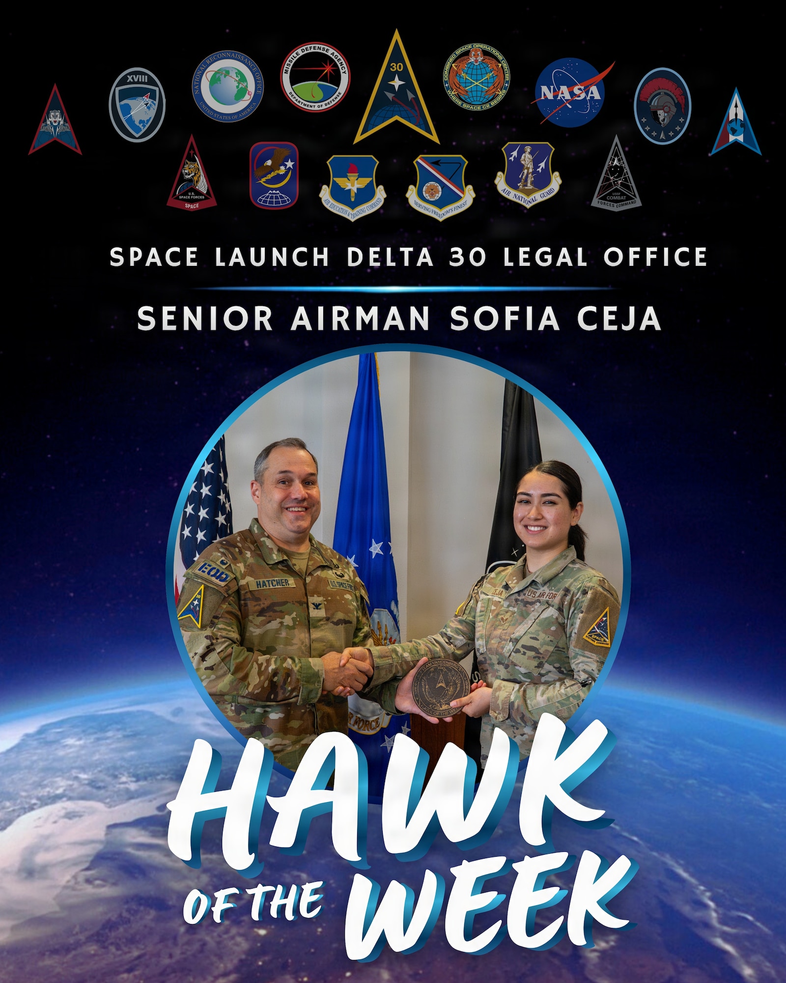 Two people stand near each other and pose for a photo.