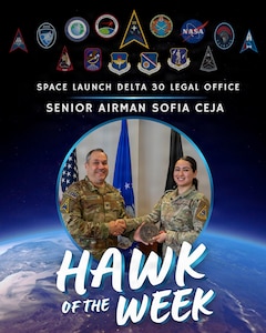 Two people stand near each other and pose for a photo.