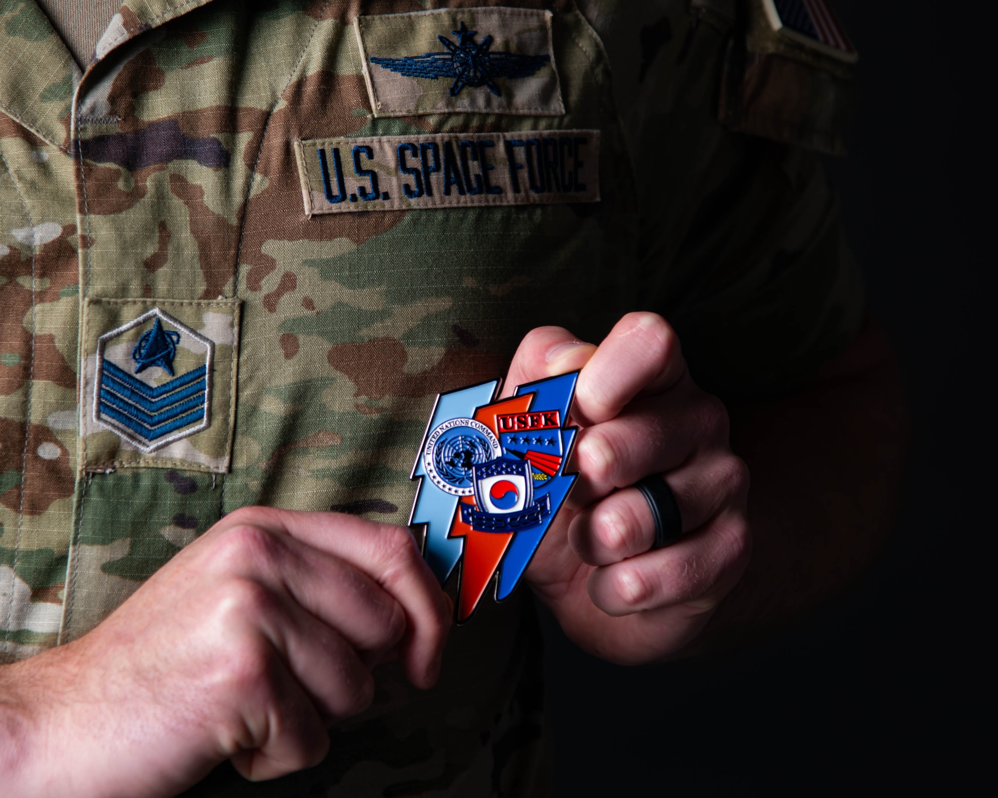 U.S. Space Force Tech. Sgt. Stephen J. Kaiser, section chief of defensive cyber operations with Space Launch Delta 45's 645th Cyberspace Squadron. April 9, 2026.  Kaiser served as Space Forces Korea’s liaison officer inside U.S. Forces Korea’s Joint Network Coordination Center, part of the J6 directorate. His steady performance during the exercise earned him superior performer recognition from Space Forces Korea and a coin from U.S. Forces Korea’s J6. (U.S. Space Force photo by Amanda Inman)