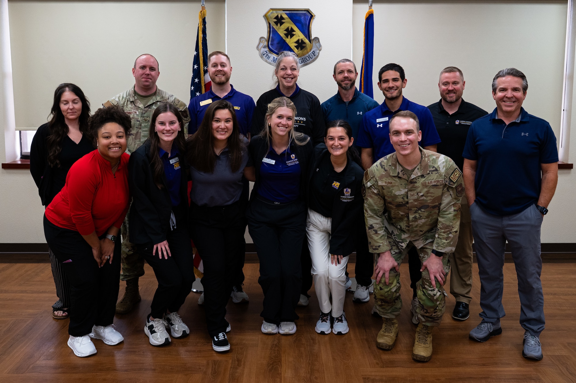 Members of the 7th Medical Group and Hardin-Simmons University physical therapy program pose for a photo during a collaborative training event at Dyess Air Force Base, Texas, April 10, 2026. The event emphasized joint learning and the practical application of physical therapy techniques to enhance Airman readiness. (U.S. Air Force photo by Senior Airman Jade M. Caldwell)