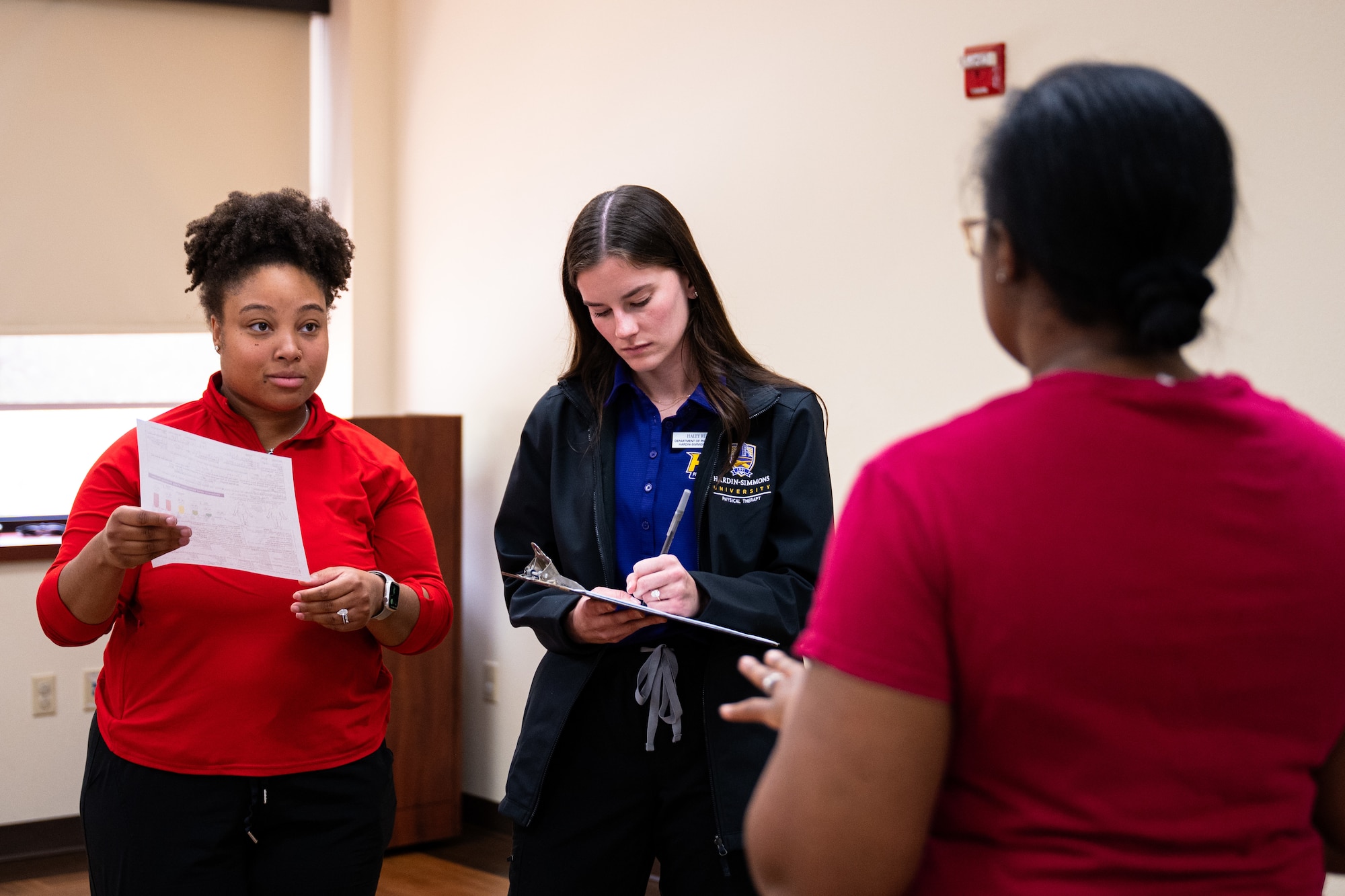 Ayanna Vioyard, left, Hardin-Simmons University contract physical therapy assistant, and Haley Ruf, HSU physical therapy student, conduct a musculoskeletal assessment during a collaborative training event with the 7th Medical Group at Dyess Air Force Base, Texas, April 10, 2026. The 7th MDG partnered with HSU to help Airmen identify pain history and develop individualized treatment plans. (U.S. Air Force photo by Senior Airman Jade M. Caldwell)