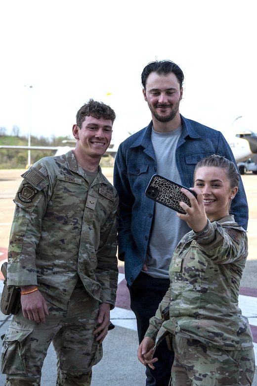 Airmen from the 171st Air Refueling Wing take a selfie with Paul Skenes, Major League Baseball pitcher for the Pittsburgh Pirates, during an All-Star Leadership Day in Pittsburgh, Pennsylvania, April 15, 2026. Airmen shared their experiences and perspectives, encouraging students to consider leadership roles and STEM-focused careers within the U.S. Air Force. (U.S. Air National Guard photo by Tech. Sgt. Zoe M. Wockenfuss)