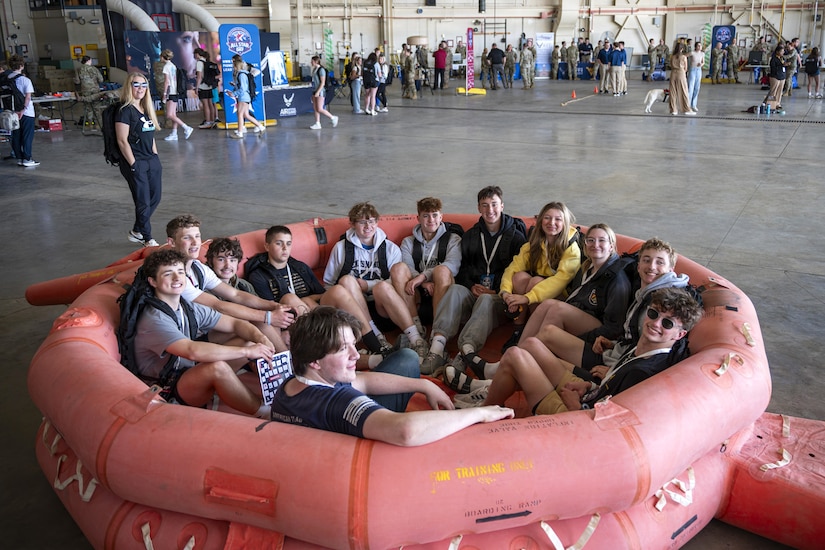 Students sit in a life raft at the 171st Air Refueling Wing during an All-Star Leadership Day in Pittsburgh, Pennsylvania, April 15, 2026. Airmen shared their experiences and perspectives, encouraging students to consider leadership roles and STEM-focused careers within the U.S. Air Force. (U.S. Air National Guard photo by Tech. Sgt. Zoe M. Wockenfuss)