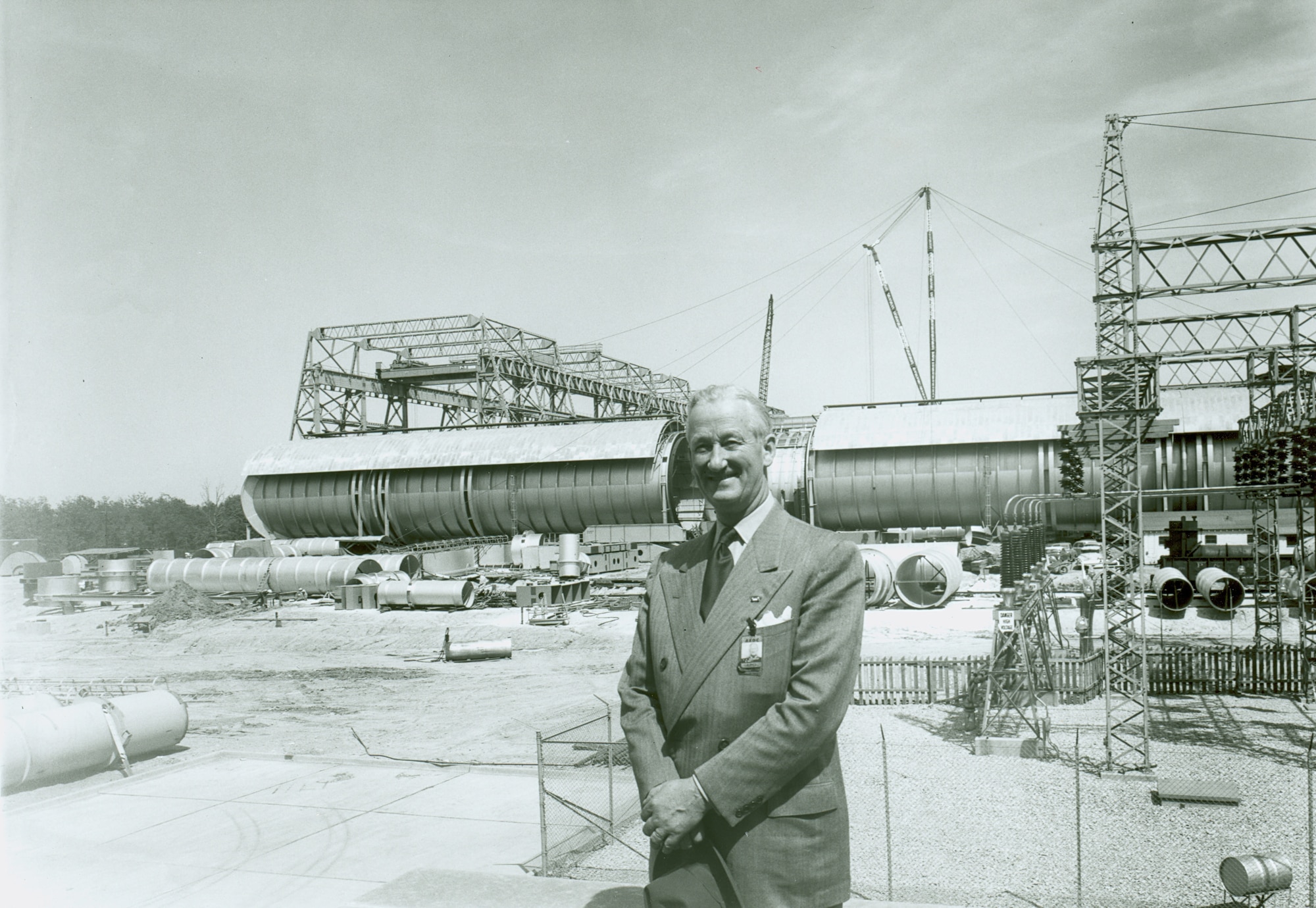 Maj. Gen. Leif Sverdrup poses for a photo in front of the then-under construction Arnold Engineering Development Center test facility in 1955. Sverdrup served as president of Arnold Research Organization Inc., the first company awarded a contract to operate AEDC. (U.S. Air Force photo)