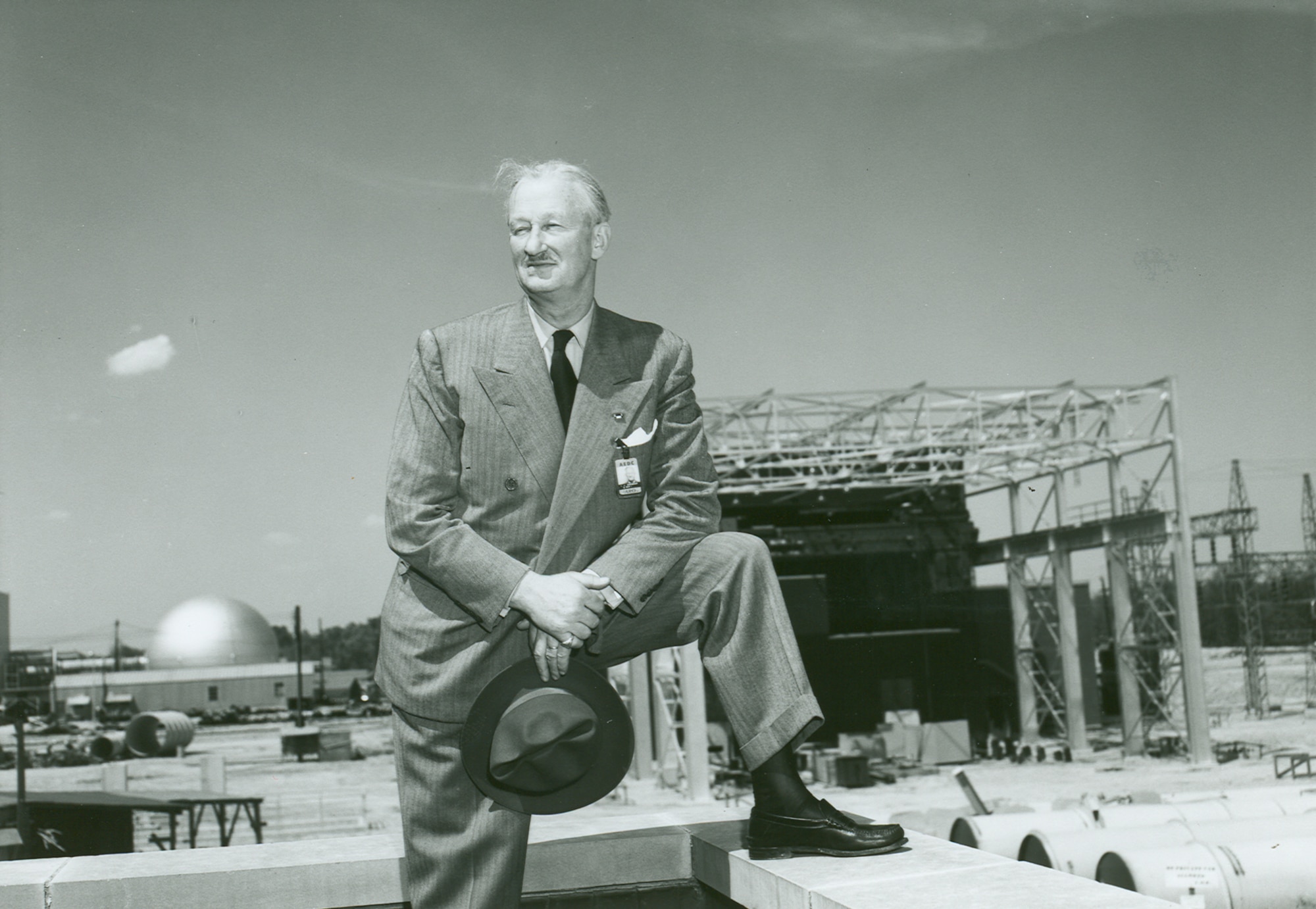 Maj. Gen. Leif Sverdrup poses for a photo in front of the then-under construction Arnold Engineering Development test facility in 1955. Sverdrup served as president of Arnold Research Organization Inc., the first company awarded a contract to operate AEDC. (U.S. Air Force photo)