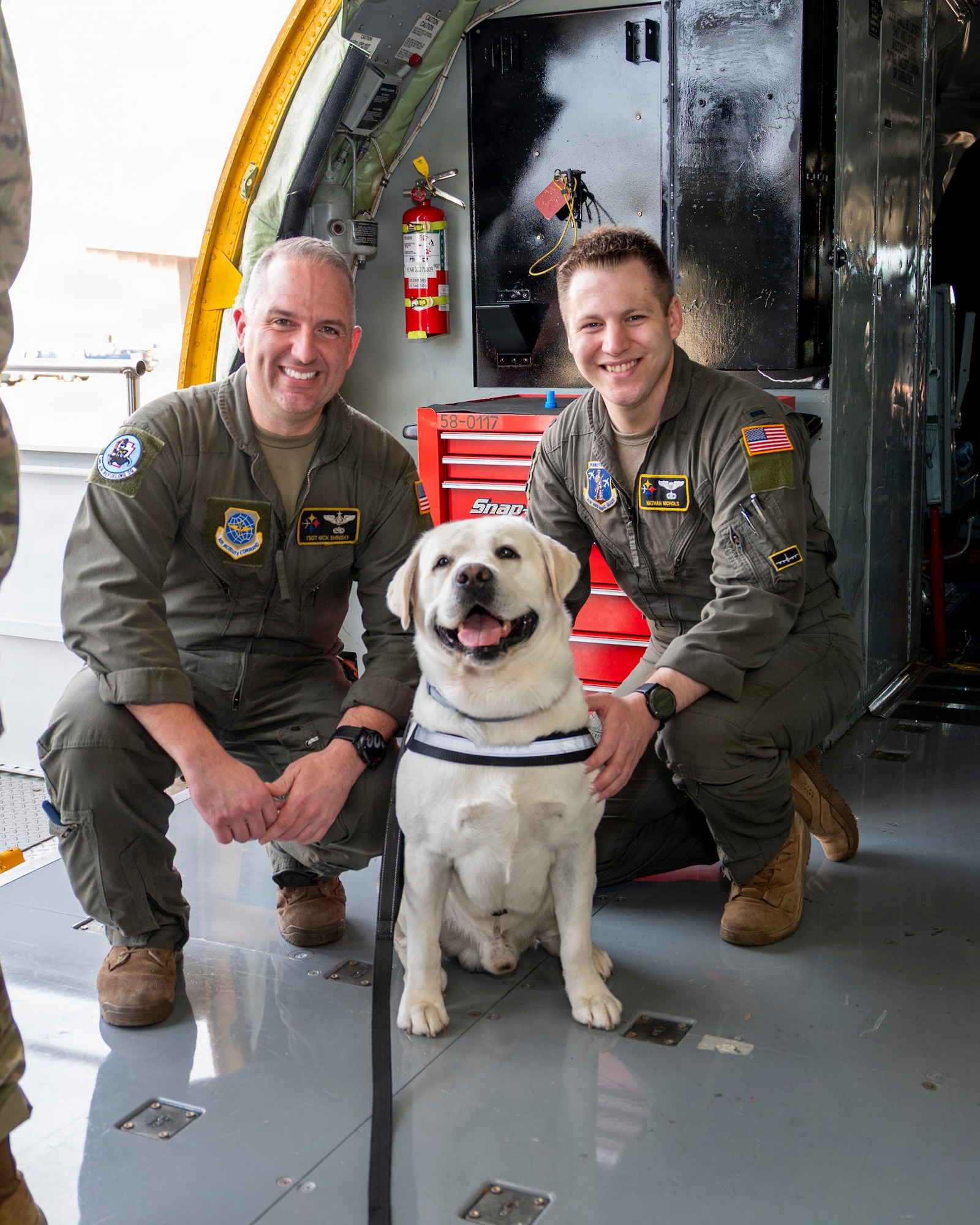Airman from the 171st Air Refueling Wing take a photo with Gunner, a Pittsburgh Airport Therapy Dog, during an All-Star Leadership Day in Pittsburgh, Pennsylvania, April 15, 2026. Airmen shared their experiences and perspectives, encouraging students to consider leadership roles and STEM-focused careers within the U.S. Air Force. (U.S. Air National Guard photo by Tech. Sgt. Zoe M. Wockenfuss)