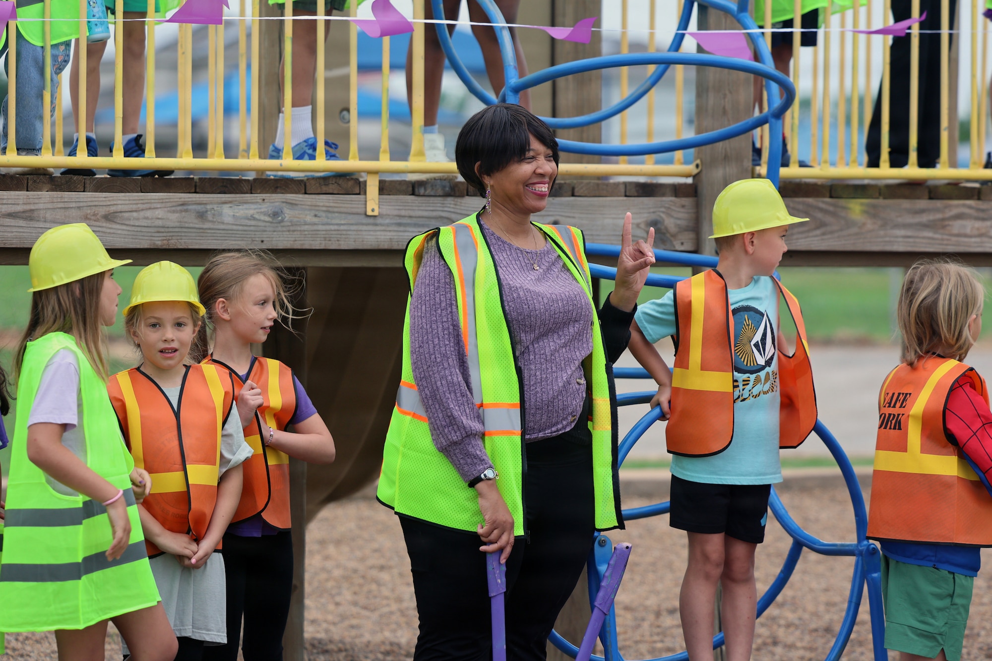 Second grade teacher and scout leader La'Chandra Hooper poses for a photo with newly upgraded playground equipment at Sheppard Elementar