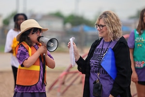Sheppard Elementary student Margot Terrell reads a speech about a petition she started to get upgraded playground equipment