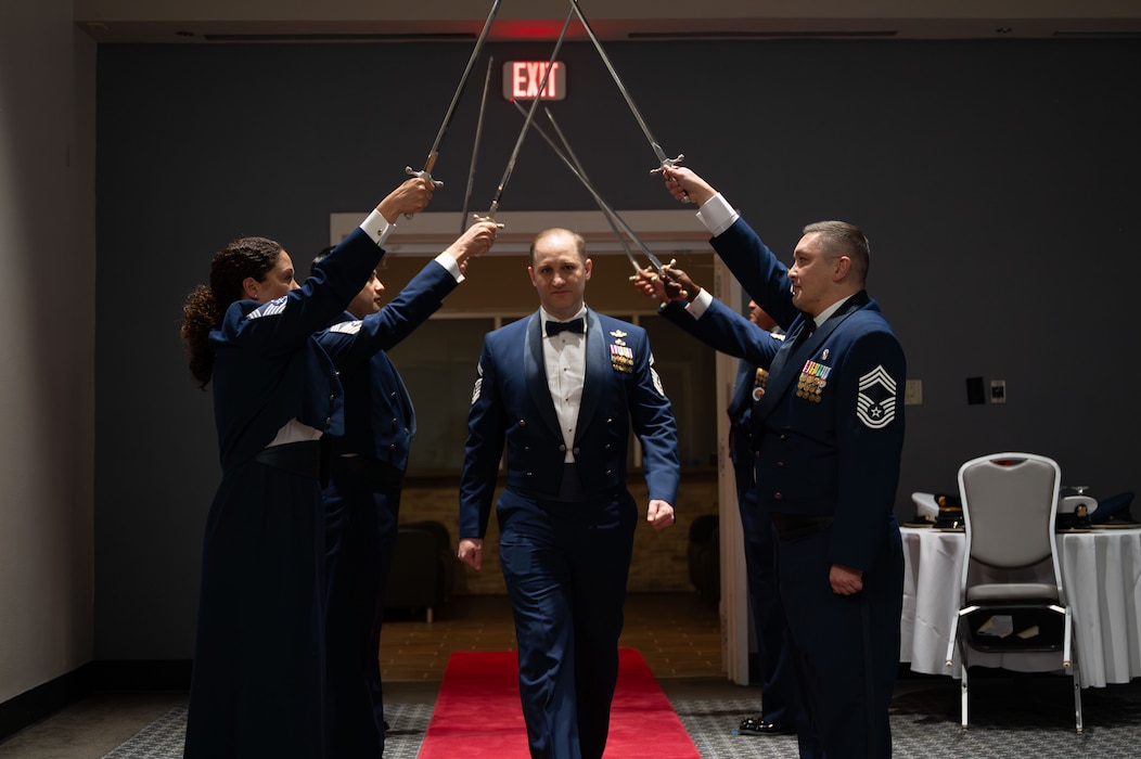 U.S. Air Force Chief Master Sgt. Select Christopher Loftus, 314th Training Squadron Operations Superintendent, walks the cordon of honor at the Chief Recognition Ceremony.