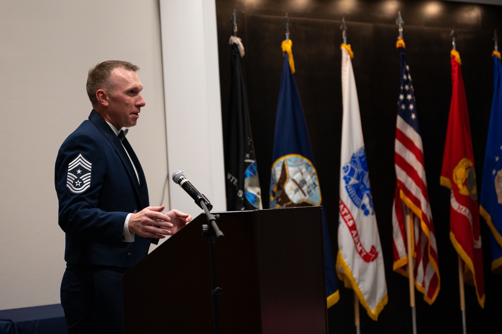 U.S. Air Force Chief Master Sgt. Derek Neill, 17th Training Wing command chief, speaks at the Chief Recognition Ceremony at the Powell Event Center.