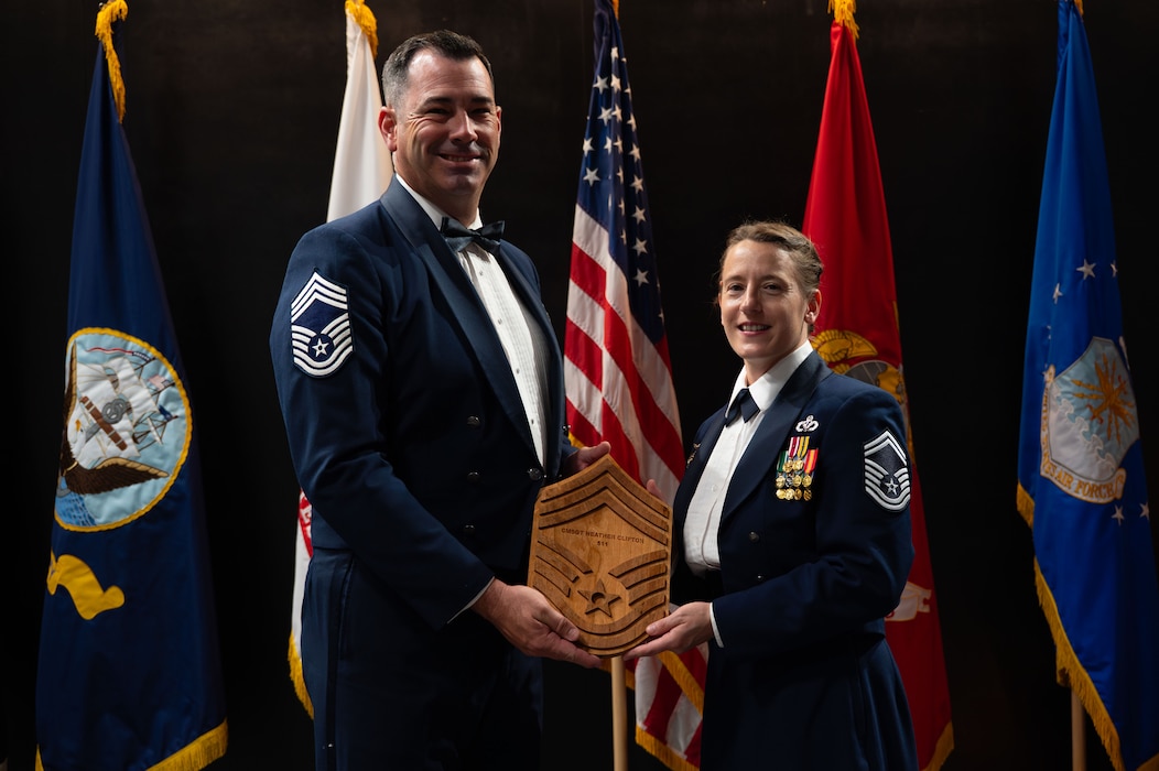 U.S. Air Force CMSgt. Mike Nalley, 312th Training Squadron senior enlisted advisor, and Chief Master Sgt. Select Heather Clifton, 312th Training Squadron Superintendent, poses for a picture during the Chief Recognition Ceremony.