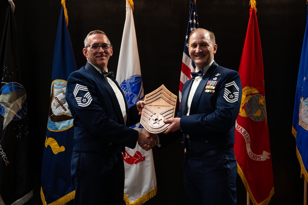 U.S. Air Force CMSgt. Craig Hawthorne, 314th Training Squadron senior enlisted leader, and Chief Master Sgt. Select Christopher Loftus, 314th Training Squadron Operations Superintendent, pose for a picture during the Chief Recognition Ceremony.