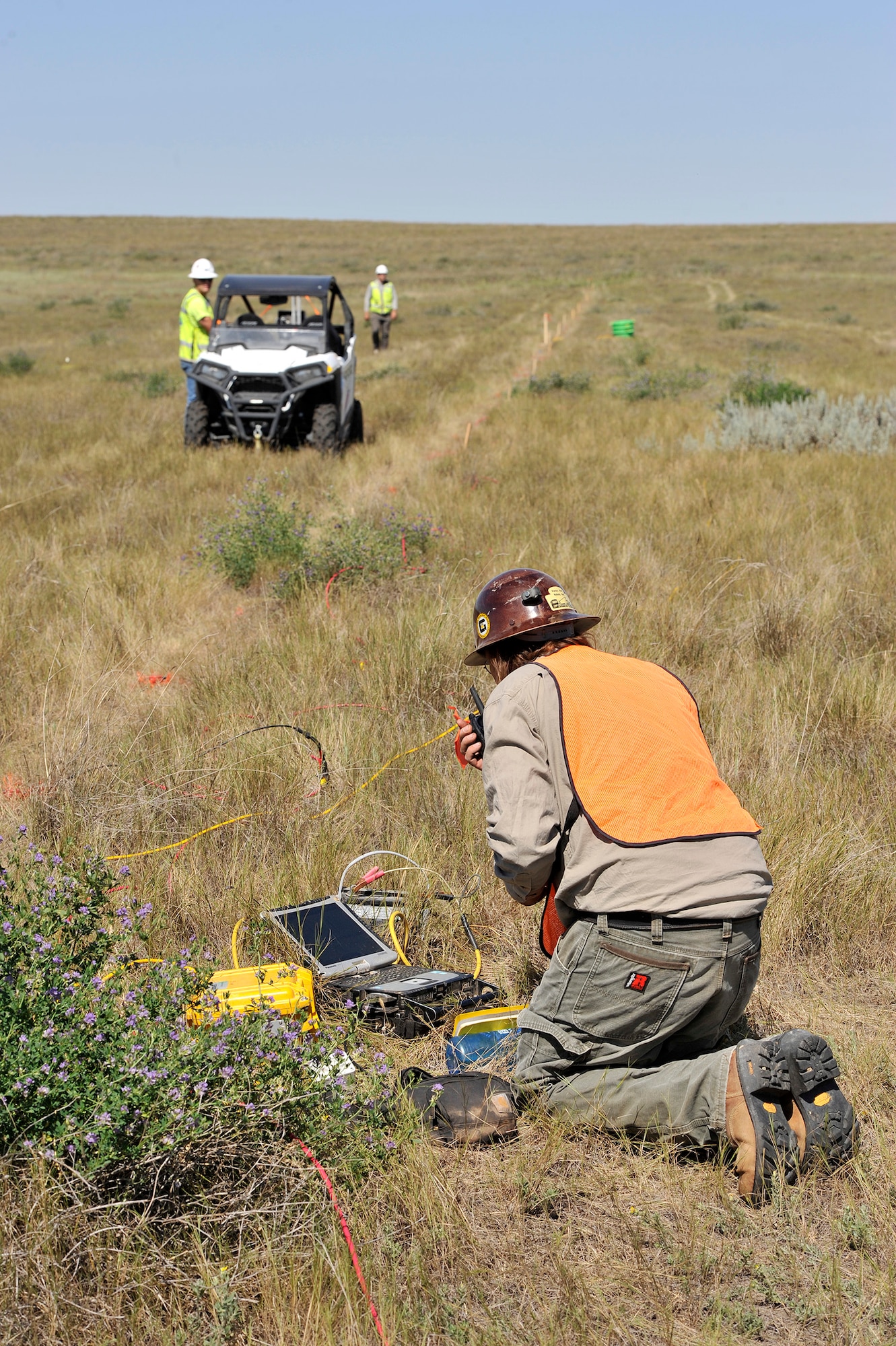 A geophysicist records seismic waves.