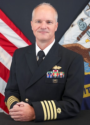 military officer poses for official photo