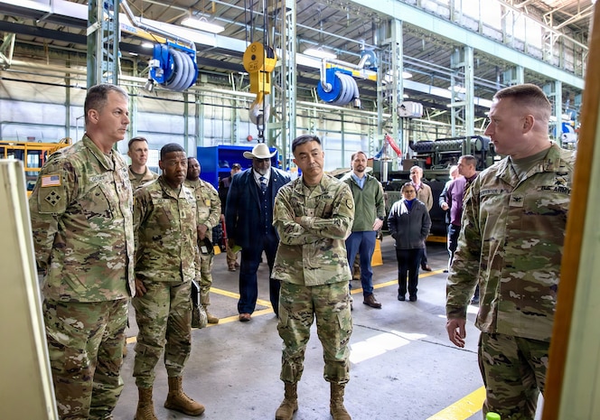 U.S. Army Maj. Gen. Gavin Gardner, commanding general of the 8th Theater Sustainment Command, and Brig. Gen. Jin Pak, commanding general of the 19th Expeditionary Sustainment Command, receive a briefing from Col. Randolph Carpenter, commander of the U.S. Army Materiel Support Command,-Korea, during a tour of the Combat Power Generation Center at Camp Carroll, Waegwan, Republic of Korea, April 7, 2026.