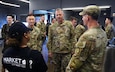 U.S. Army Maj. Gen. Gavin Gardner, commanding general of the 8th Theater Sustainment Command, and Brig. Gen. Jin Pak, commanding general of the 19th Expeditionary Sustainment Command, speak with Soldiers and staff inside the Market 19 autonomous kitchen at Camp Walker, Daegu, Republic of Korea, April 7, 2026.