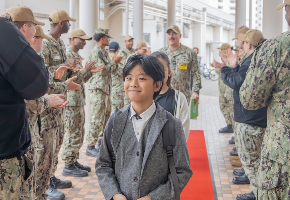 FLEET ACTIVITIES YOKOSUKA, Japan (April 7, 2026) – Commander, Fleet Activities Yokosuka (CFAY) and Department of War Education Activity (DoWEA) schools hosted a Month of the Military Child kickoff ceremony at Yokosuka Primary School and the Sullivans Elementary School at the installation's main base April 7, 2026. The event celebrated military-connected students for their resilience and contributions, featuring student-led remarks and a performance by the U.S. 7th Fleet Band, and wrapping up with a red-carpet walk as students were cheered on by their families in uniform. CFAY continues to support military families by fostering a strong, connected community and enhancing quality of life for service members and their loved ones. (U.S. Navy photo by Sheryl Sullivan)