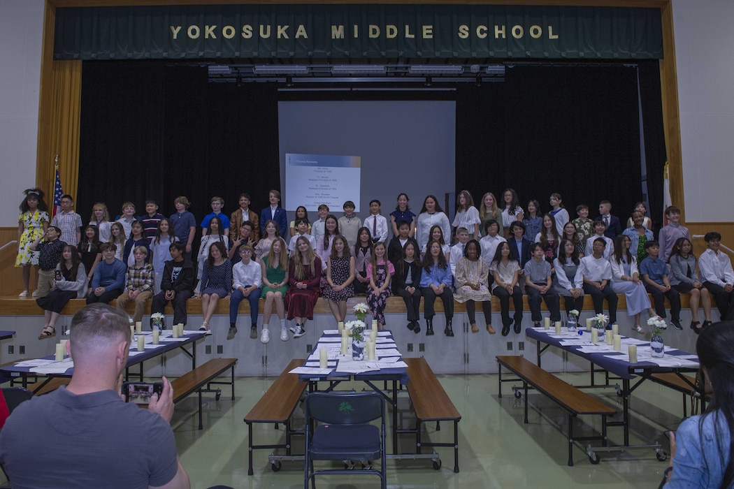 YOKOSUKA, Japan (April 9, 2026) — Students from Yokosuka Middle School pose for a group photo after being inducted into the National Junior Honor Society during a ceremony at Commander, Fleet Activities Yokosuka, April 9, 2026. Sixty-seven Yokosuka Middle School students were inducted into the National Junior Honor Society, which recognizes excellence in scholarship, leadership, service, character and citizenship. (U.S. Navy photo by Mass Communication Specialist 2nd Class Quinton A. Lee)
