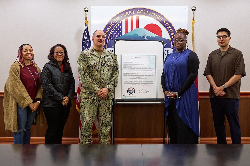 FLEET ACTIVITIES YOKOSUKA, Japan (April 10, 2026) -- Capt. Jonathan Hopkins, Commander, Fleet Activities Yokosuka (CFAY), poses with CFAY Fleet and Family Readiness (FFR) and CFAY Fleet and Family Support Center (FFSC) staff after signing the Sexual Assault Awareness and Prevention Month (SAAPM) Proclamation April 10, 2026. The month of April is nationally recognized as SAAPM to raise awareness and refresh commitment to the relevant programs. (U.S. Navy photo by James Kimber)