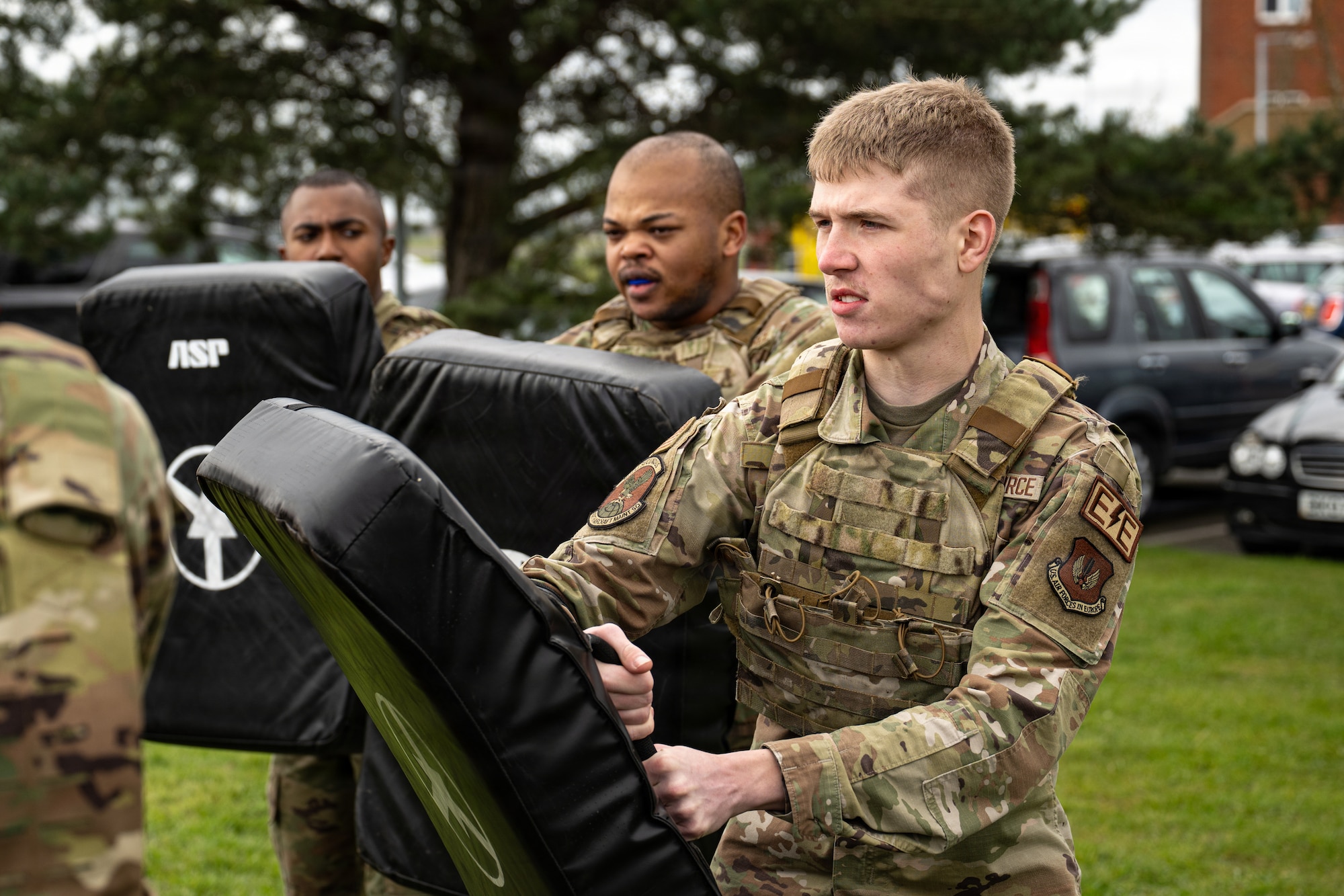 U.S. Air Force Airman 1st Class Jacob Barnes, right, 100th Maintenance Squadron electrical and environmental systems journeyman, participates in a defensive tactics training at RAF Mildenhall, England, March 16, 2026.