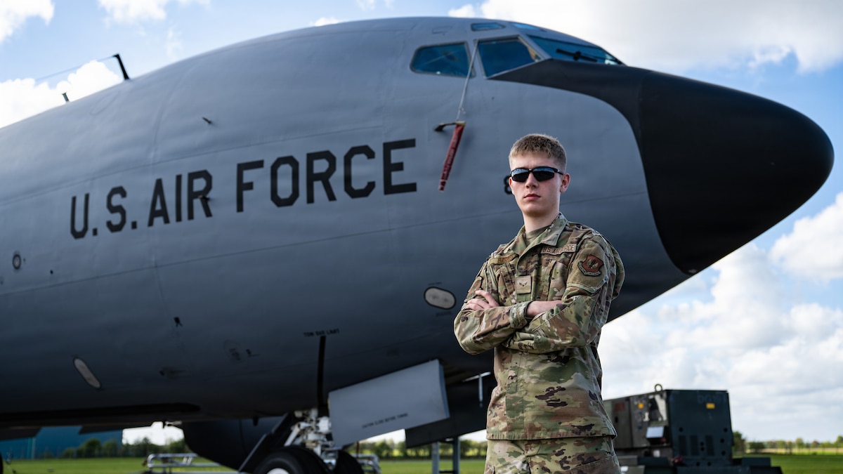 U.S. Air Force Airman 1st Class Jacob Barnes, 100th Maintenance Squadron electrical and environmental systems journeyman, poses in front of a 100th Air Refueling Wing KC-135 Stratotanker at RAF Mildenhall, England, April 13, 2026.