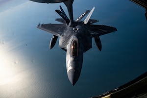 A U.S. Air Force 1st Fighter Wing F-22 Raptor approaches a 100th Air Refueling Wing KC-135 Stratotanker for fuel during a mission over the North Sea, March 5, 2026.
