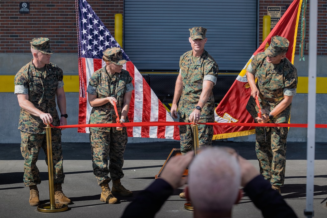 U.S. Marine Corps leaders participate in a ribbon cutting ceremony at the new Individual Issue Facility on Marine Corps Base Camp Lejeune, North Carolina, April 14, 2026. The new Class II Logistics Facility consolidates both the Consolidated Storage Program’s high-volume Individual Issue Facility operations and the Class II Sustainment Program’s technical maintenance and repair mission, ensuring Marines are more efficiently equipped and mission ready. (U.S. Marine Corps photo by Lance Cpl. DeCrane)