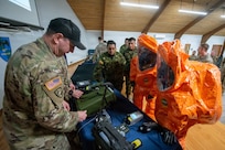 A U.S. Army Soldier from the Kentucky National Guard’s 41st Weapons of Mass Destruction Civil Support Team demonstrates equipment used to test for hazardous airborne isotopes for members of the Ecuadorian military at the Kentucky Air National Guard base in Louisville, Ky., March 9, 2026.