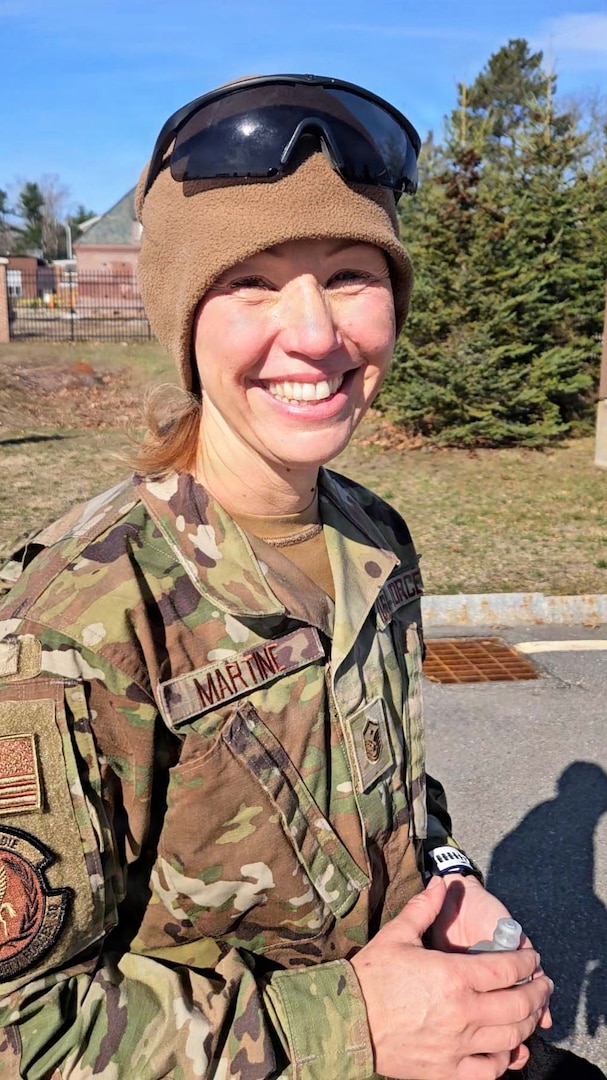 Master Sgt. Amber Martine is all smiles after crossing the finish line of a Norwegian Foot March hosted by the New Hampshire National Guard on April 12, 2026, in Concord, New Hampshire.