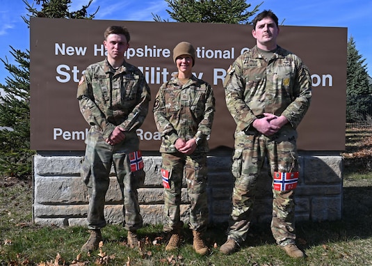 From left, Cadet Quinn LaRock of University of New Hampshire’s Army ROTC program; Master Sgt. Amber Martine, 157th Security Forces Squadron; New Hampshire Air National Guard; and Staff Sgt. Timothy Bowman, recruiter with New England Recruiting Battalion; assemble after completing a Norwegian Foot March on April 12, 2026, at the state military reservation in Concord, New Hampshire.