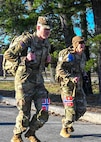 Competitors race along the state military reservation during a Norwegian Foot March on March on April 12, 2026, in Concord, New Hampshire.
