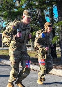 Competitors race along the state military reservation during a Norwegian Foot March on March on April 12, 2026, in Concord, New Hampshire.